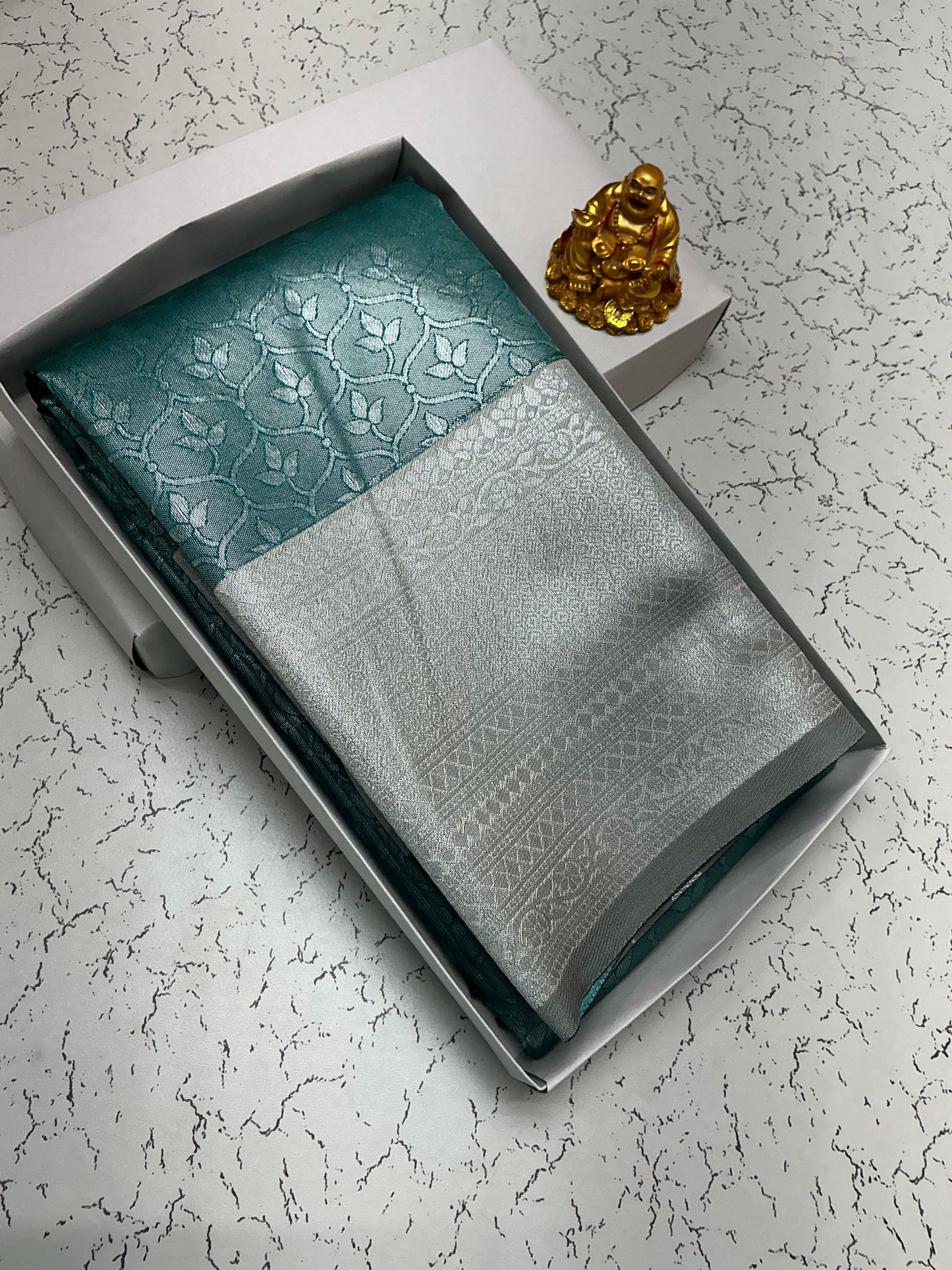 Silver Bridal Saree with Teal Leaf Pattern and Silver Border