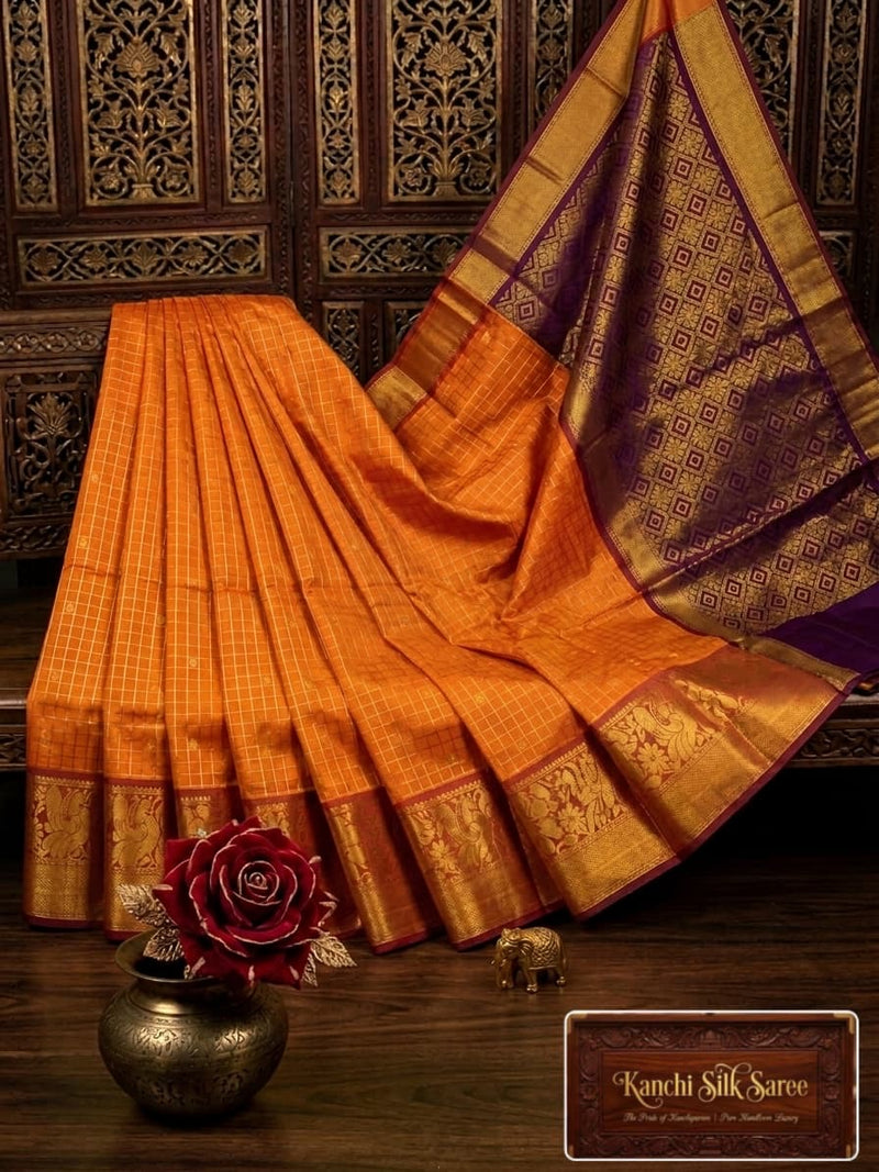 Kanchi Silk gold zari checked Orange saree with gold border and purple