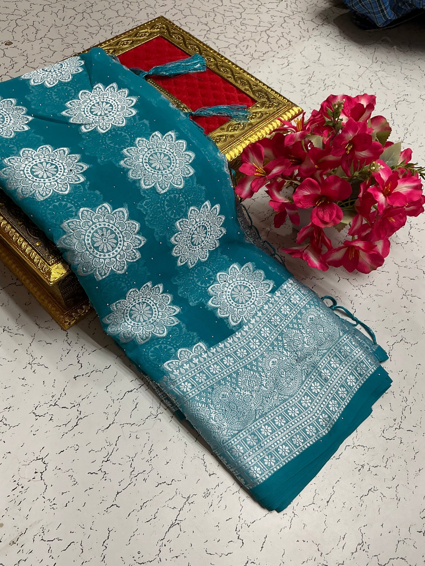 Georgette fancy saree with teal blue with silver flowers