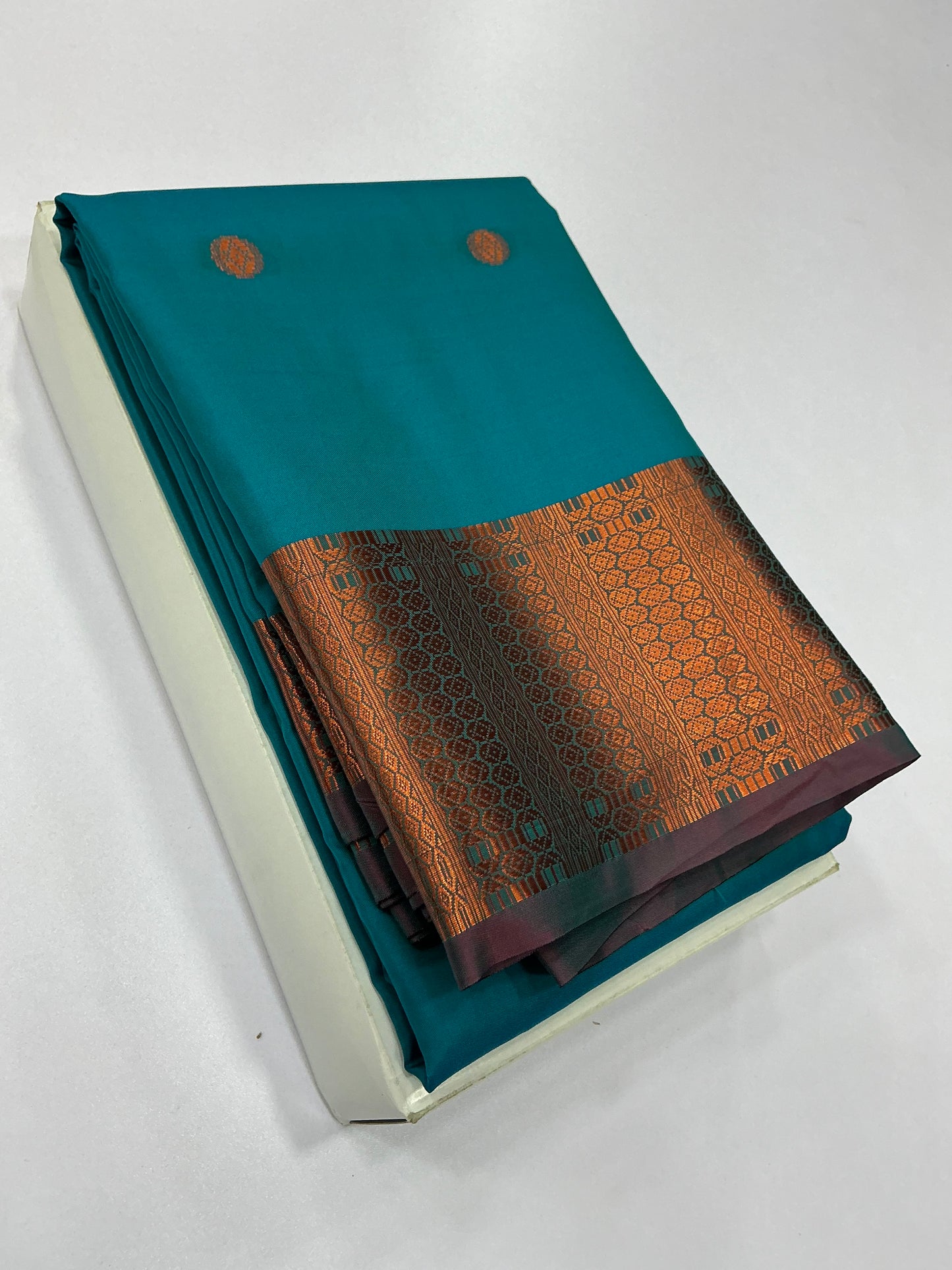 Premium Soft Silk Saree – Peacock Blue with Traditional Copper Zari Border | Sri Nandhini Tex | SNTSS021