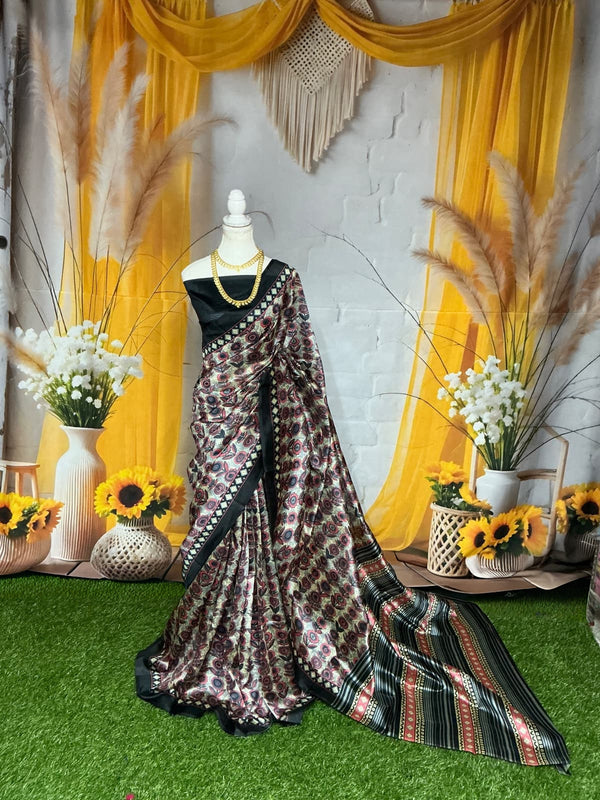 Dola Silk – Wine Black – Traditional Butta & Striped Pallu
(Dark wine print with black-red zari pallu)